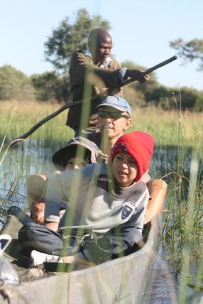 Looking for hippo on a mekoro, Okavango Delta, Botswana