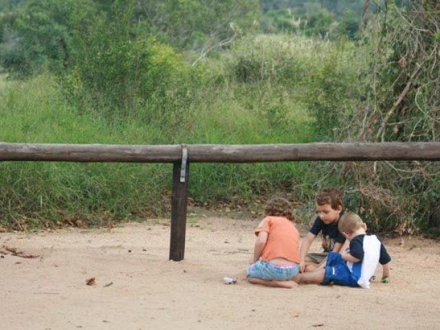 The kids playing on the sand at a Picnic Site near Satara, Kruger National Park