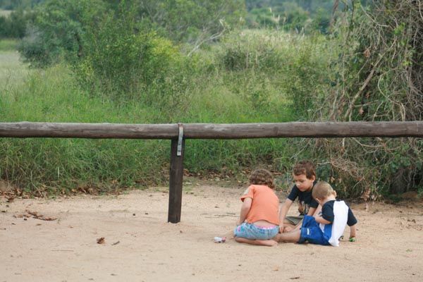 The kids playing on the sand at a Picnic Site near Satara, Kruger National Park