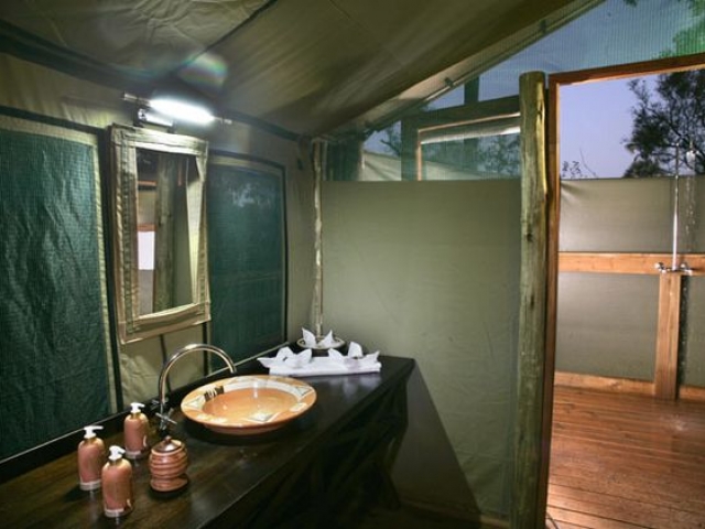 Moremi Crossing, safari tent open air bathroom, Botswana and Zimbabwe