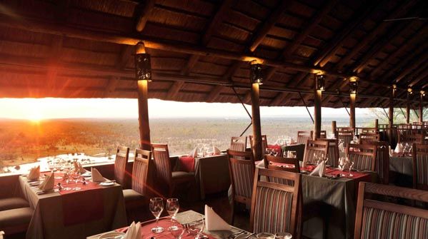 Victoria Falls Safari Lodge, thatch roofed restaurant with views, Botswana and Zimbabwe