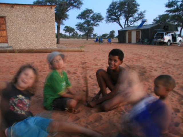 Playing in the sand with the #Khomani San in the Kalahari, South Africa