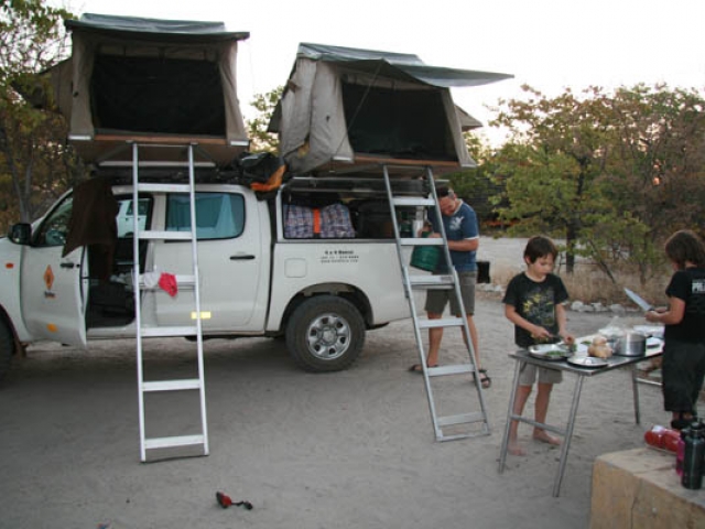 Camp cooking, Planet Baobab, Botswana - they always seem to help more when we are travelling than at home!