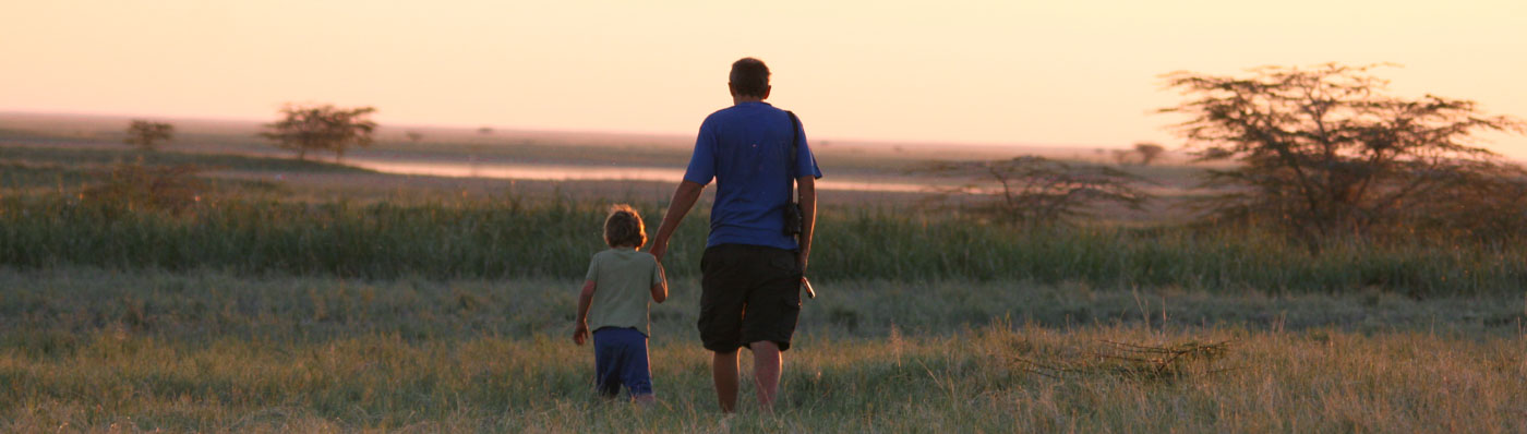 Chris and Cadan walking in Nata bird Sanctuary, Botswana
