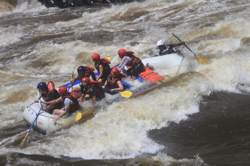 A look of delight on Kai's face as the raft zooms into the rapid!