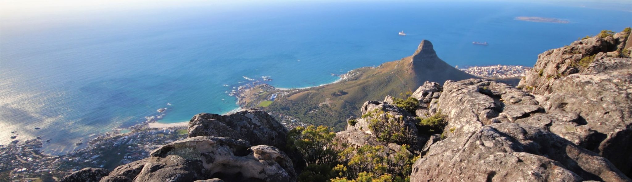 Stunning view over the blue ocean and Signal Hill from Table Mountain, Cape Town