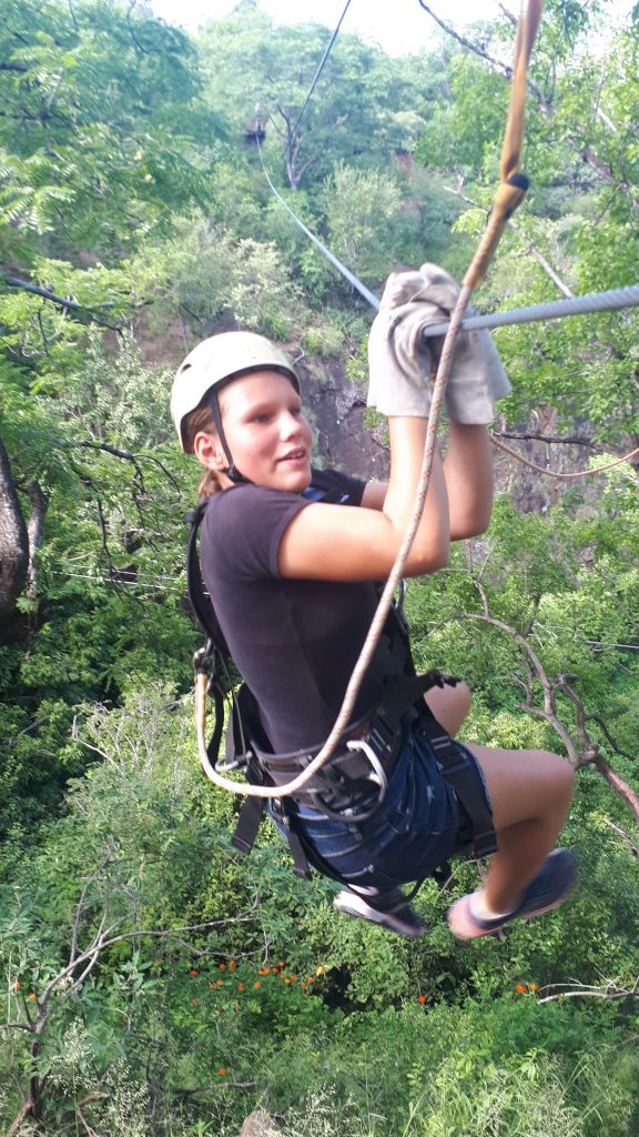 Rhian pulling herself up one of the zip lines.