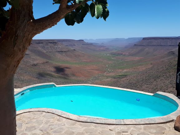 Grootberg Lodge's incredible pool with a view of the valley behind it, Namibia.