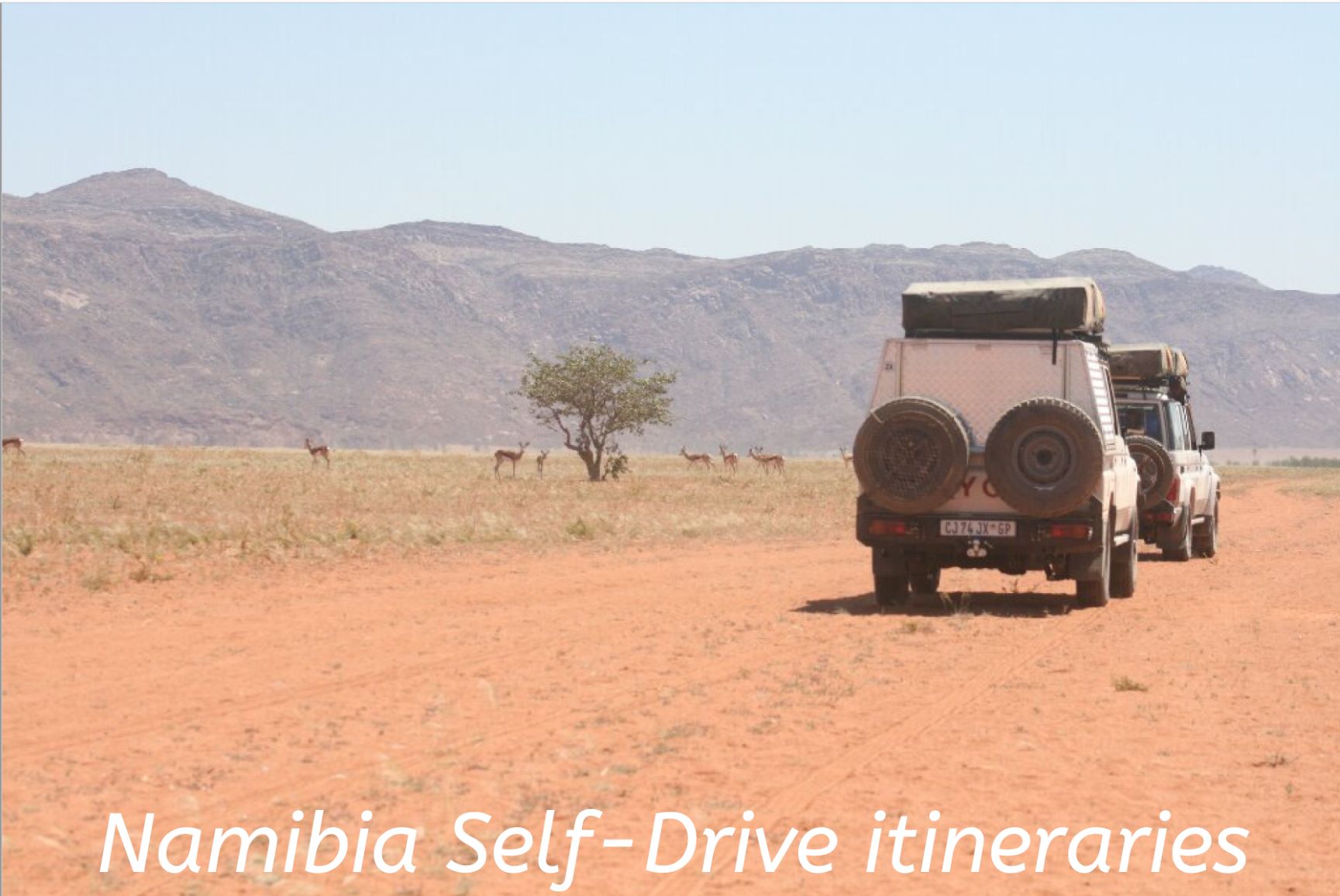 The words 'Namibia self-drive itineraries' set over an imagine of two 4WDs travelling in convoy through the Namibian desert landscape