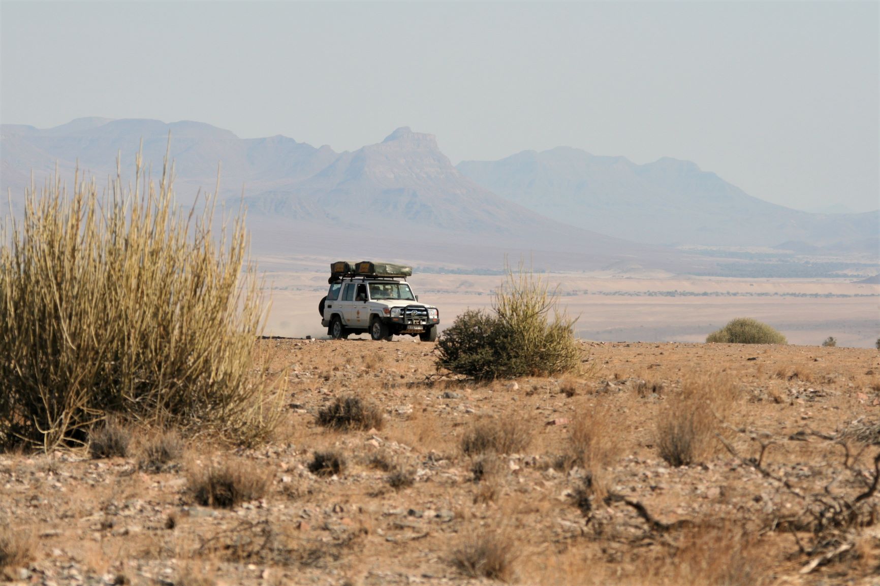 A 4WD self drive vehicle on a ridge in Damaraland, northern Namibia